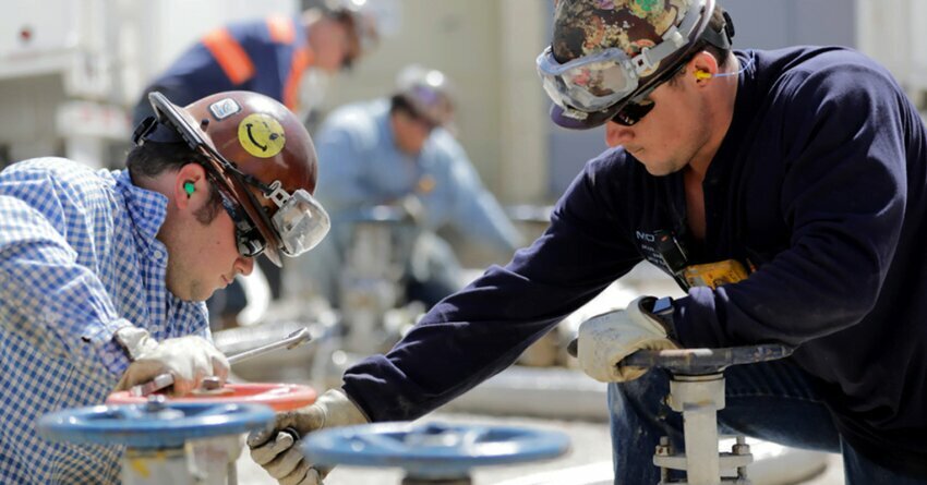 Two refinery workers at ExxonMobil's Beaumont plant