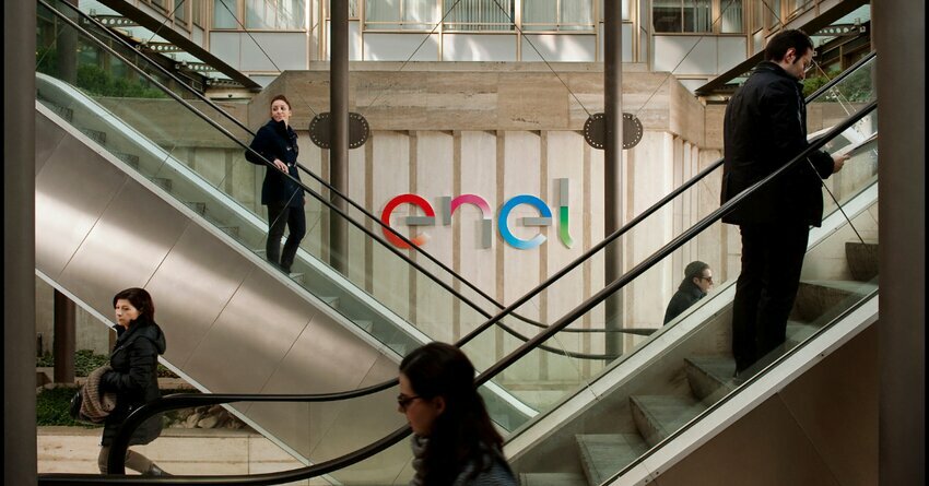 Enel HQ in Rome Italy. People standing on escalators. Enel X