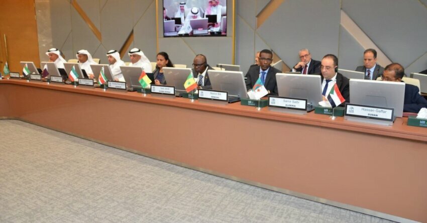 IsDB Linkedin Image of men sitting at a long table in front of computers