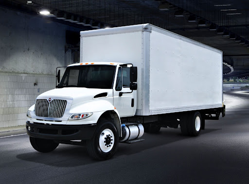 Delivery truck driving through tunnel overnight